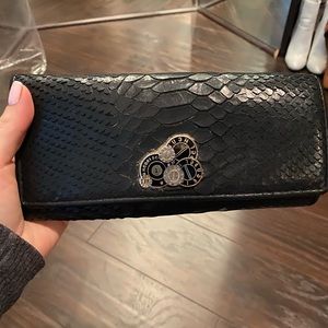 Henri Bendel black textured wallet.